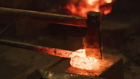 Wet axe pounded into glowing hot steel so it can be folded. Traditional Japanese Video stock 125433365