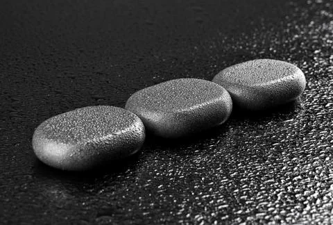 Wet basalt stones Stock Photos