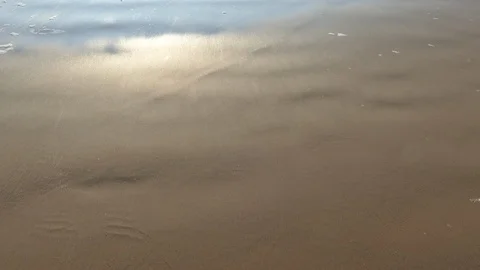 Wet Beach sand drying after waves Stock-Footage 116196388