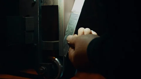 A Wet blade gets sharpened Stock Footage 275447800