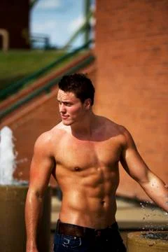 Wet bodybuilder Stock Photos