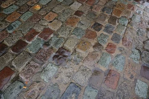 Wet Bricks pavement old stone sidewalk Stock Photos