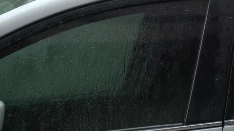Wet car glass on back. Raindrop on car window Stock Footage 242133722