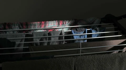 Wet clean clothes hang on the clothes hanger Stock Footage 141076216