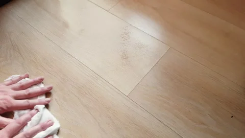 Wet clean-up of dust on the floor with a white rag. Stock Footage 243713035