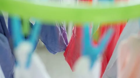 Wet Clothes Cleaned with Laundry Machine Hanging to Dry Vidéo 133486739