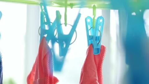 Wet Clothes Cleaned with Laundry Machine Hanging to Dry Vidéo 134973464
