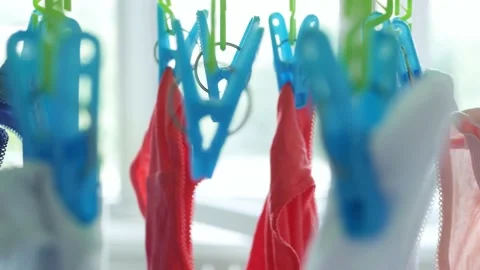 Wet Clothes Cleaned with Laundry Machine Hanging to Dry Vidéo 138144943