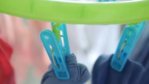 Wet Clothes Cleaned with Laundry Machine Hanging to Dry Vidéo 140779113
