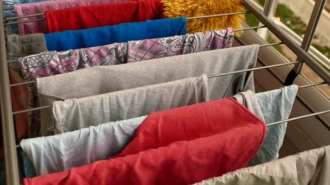 Wet clothes drying on the balcony, Stock Footage 107849205