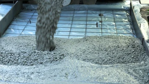 Wet concrete pouring into foundation formwork Stock-Footage 342703036