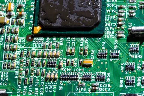Wet digital circuit board with microprocessors and components, closeup full Stock Photos