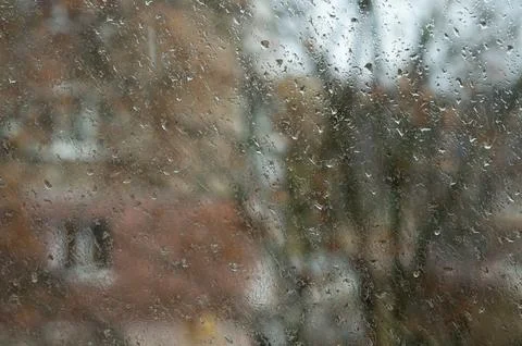 Wet glass window, abstract backdrop. Water droplets merging into rivulets, .. Stock Photos