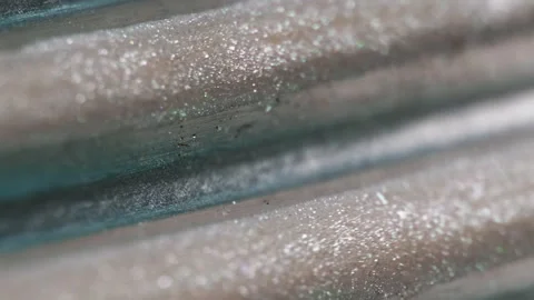 Wet glitter drip metallic fluid spill silver blue Stock Footage 285697957