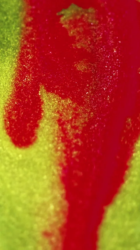 Wet glitter flow ink drip red yellow fluid spill Stock Footage 274177687