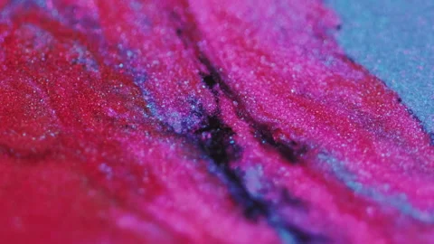 Wet glitter texture paint mix pink red blue ink Video stock 274626258