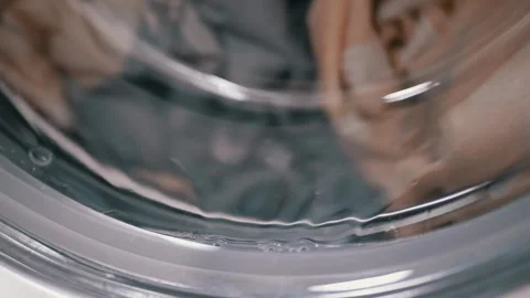 Wet Laundry Tumbling Inside Front Load Washing Machine Glass Door 動画素材 332666527