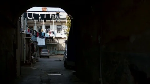 Wet laundry in the yard. View from the acrh of the house. Stock Footage 82643258