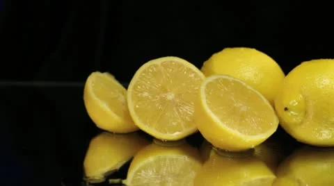 Wet Lemons on Black with Slider Stock Footage 11889532