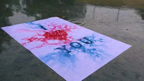 Wet love letter dissolving during heavy rain Stock Footage 342678060