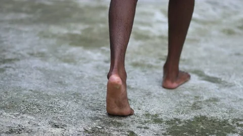 A Wet Man With Dreadlocks Walking and Wandering after in The Nature Stock Footage 209134783