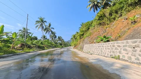 Wet Mountain Highway with Right Side Dramatic Cliff Gap Stock Footage 338157165