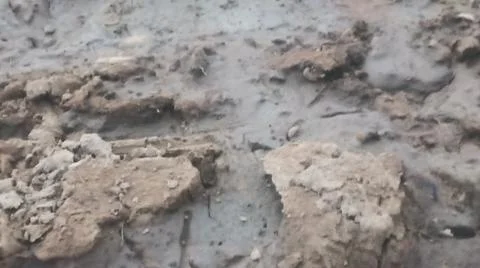 Wet Mud and Eroded Clay Ground Surface Texture Stock Photos