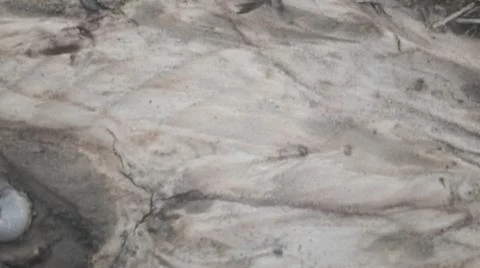 Wet Mud and Eroded Clay Ground Surface Texture Stock Photos
