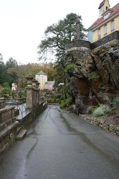 Wet Paved Path Through Unique Portmeirion Village Architecture And Gardens, Stock Photos