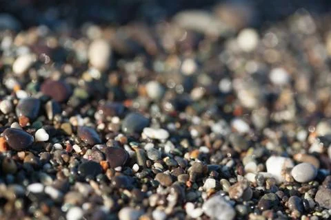 Wet pebble texture close up Stock Photos