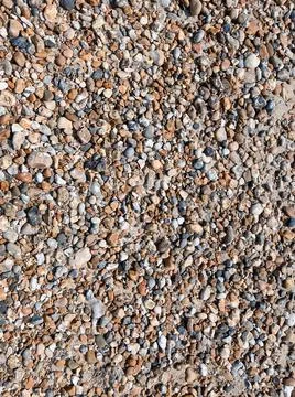 Wet pebbles on the beach texture Stock Photos