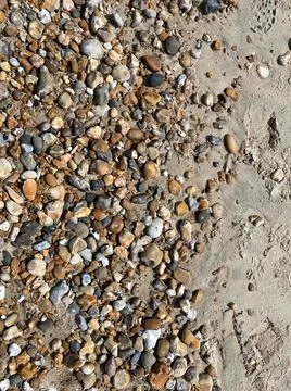 Wet pebbles on the beach texture Stock Photos
