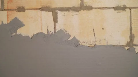 Wet plaster application on aerated concrete block wall Stock Footage 335516406