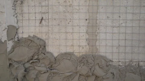 Wet plaster applied to drywall for wall repair Stock Footage 323703563
