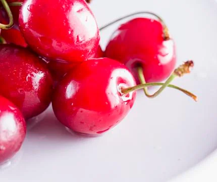 Wet red cherries Stock Photos