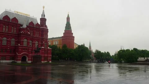 Wet Red square pavement without tourists in rainy afternoon. Pandemic Stock Footage 133251819
