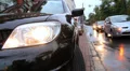 Wet road city traffic, cars drive lights on HD Footage