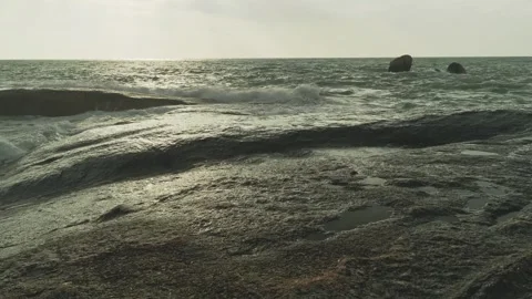 Wet rocks and wave motion over stones Stock Footage 331836197