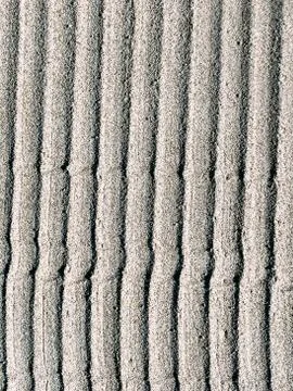 Wet sand texture, beach, background Stock Photos