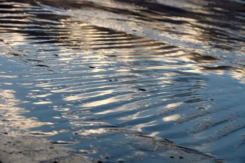 Wet sand waves. Stock Photos