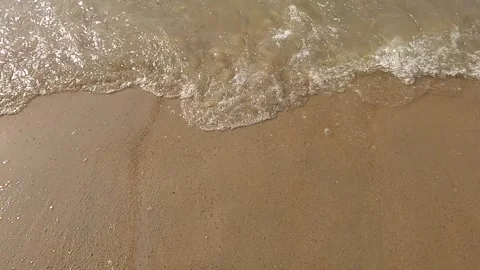 Wet sandy beach with MicrostockPlus logo, ideal for nature, relaxation, seaside Stock Footage 276161214