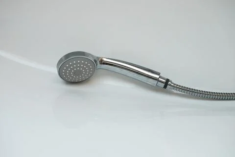 Wet shower head lying in the shower stall. Close up, copy space Stock Photos
