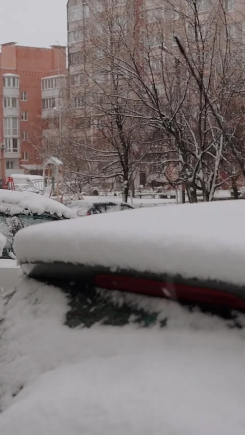 Wet snow covers the streets and houses of a small town on Christmas. Snowfall Stock Footage 293083372