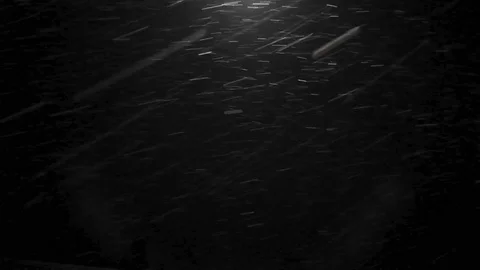 Wet snow falling at night under a bright street lamp Stock Footage 108554582