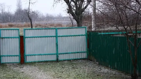 Wet snow falls on the ground Stock Footage