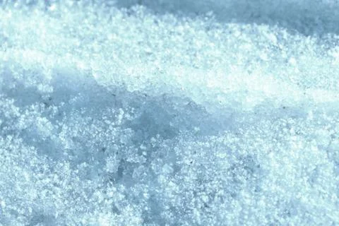 Wet spring snow texture close up. Natural abstract background blue color Stock Photos
