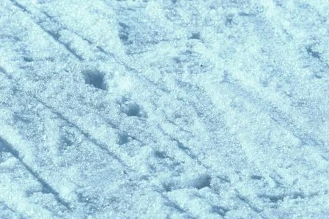 Wet spring snow texture close up. Natural abstract background blue color Stock Photos