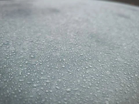 A wet surface with many small droplets of water.  Stock Photos