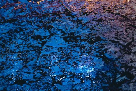 Wet surface with multi-colored lights Stock Photos