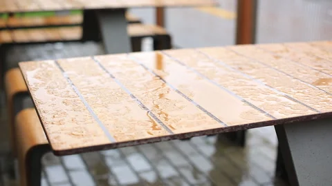 Wet table closeup outside restaurant during heavy rain Video stock 92965064